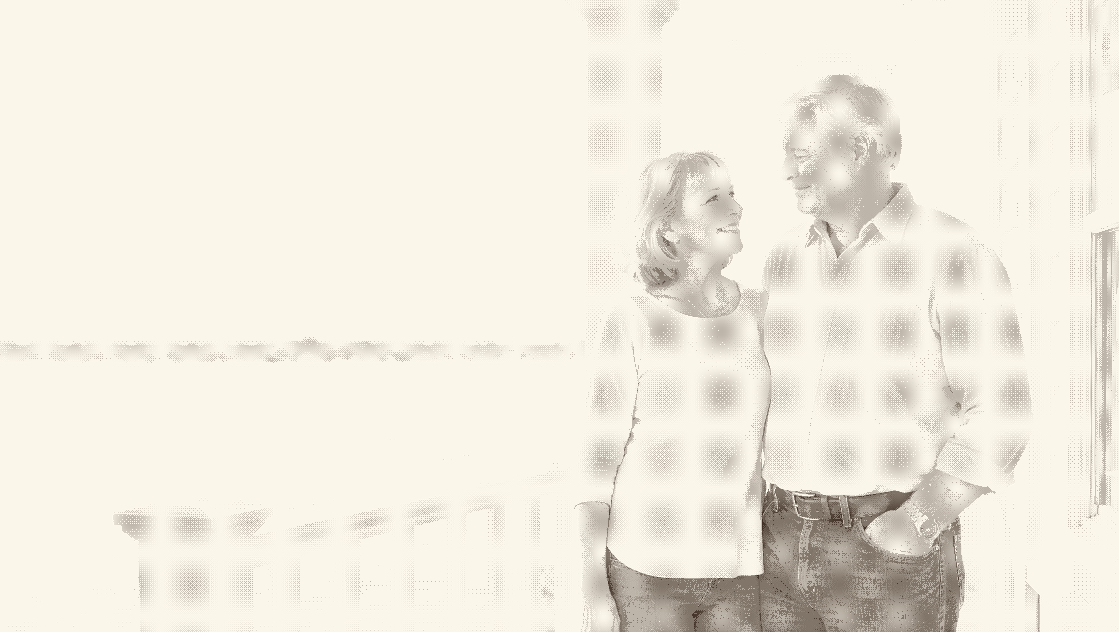 A Wisconsin couple on their front porch in early morning light.